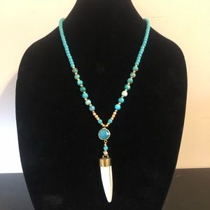 Carved horn pendant with turquoise connector and turquoise and jasper beads